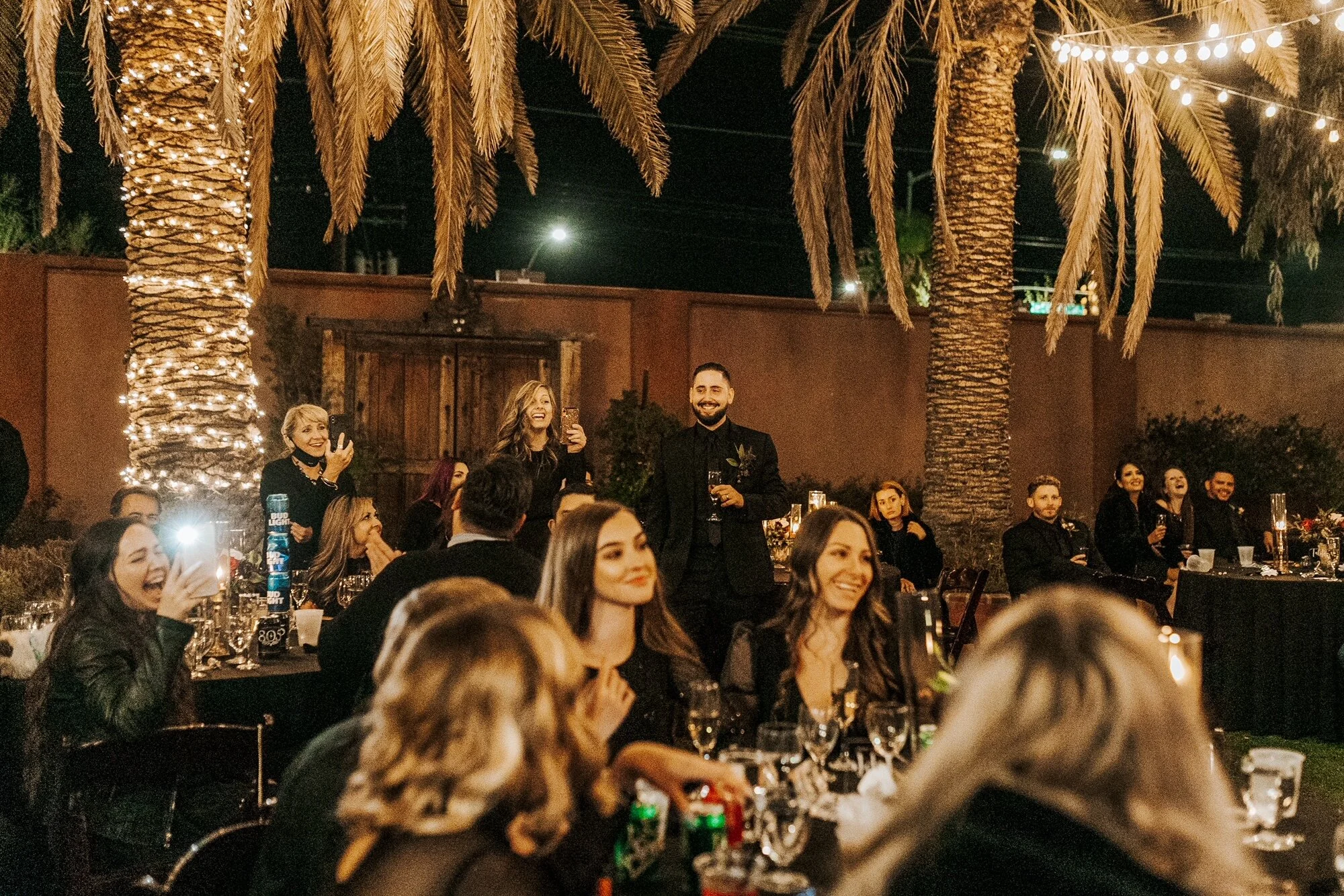 Guests at a candlelit wedding reception